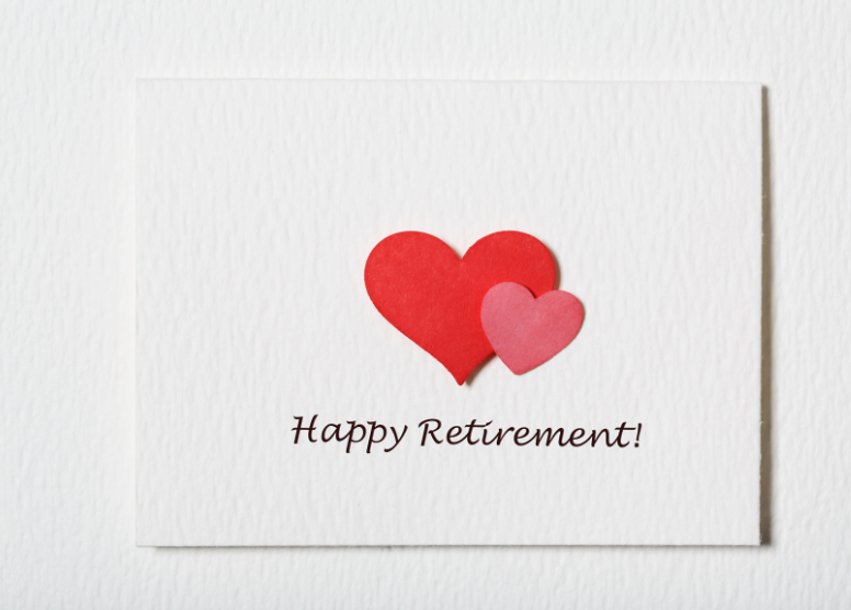 Greeting card with large red heart, small pink heart, words "Happy Retirement!"